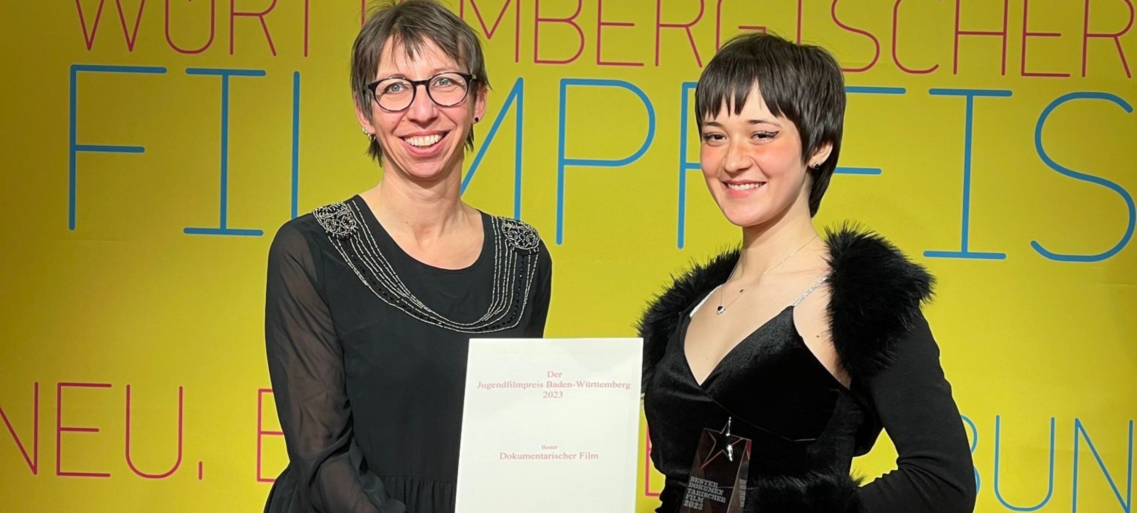 Alisa Grabowski (right) accepts her prize