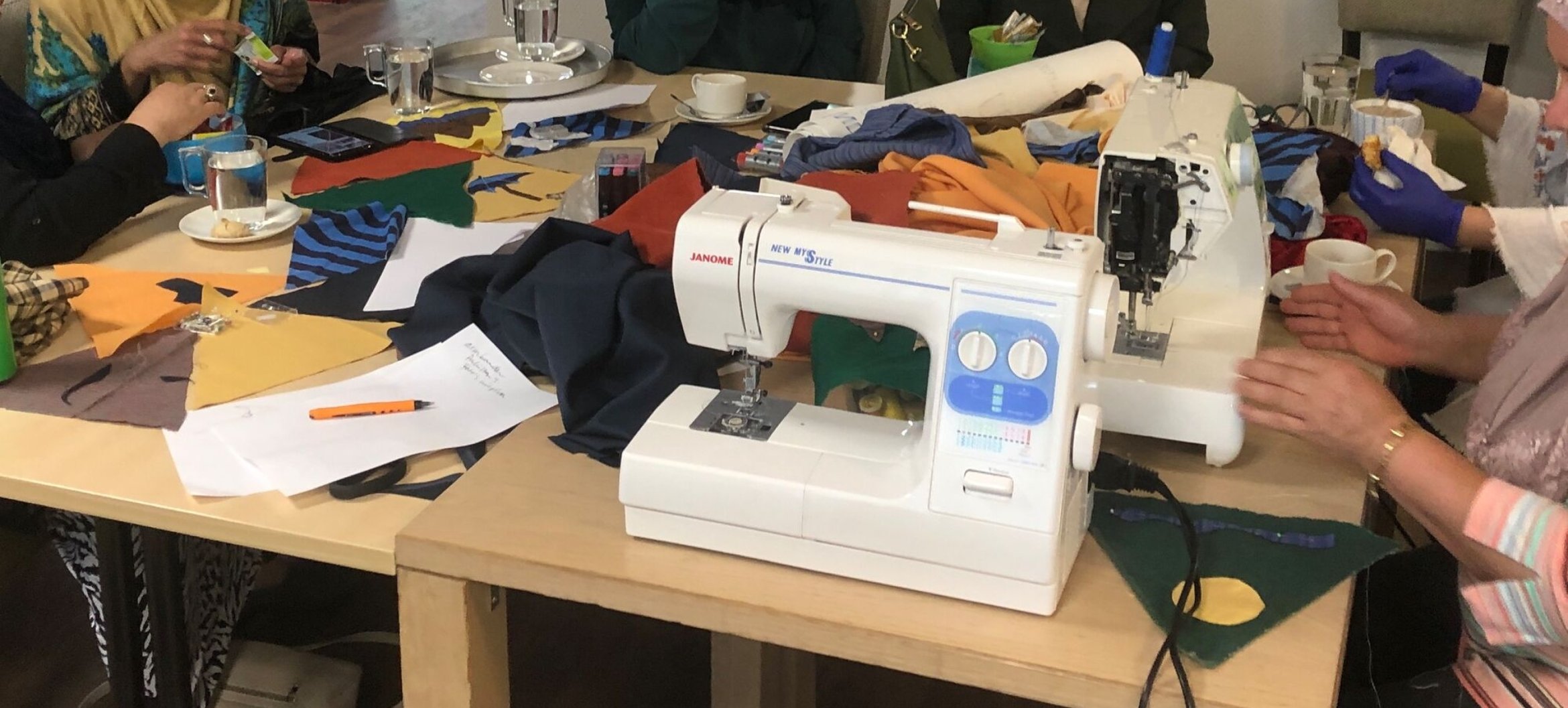 A picture of women working on a sewing project.